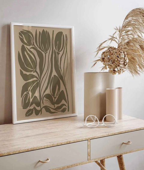 Olive green botanical wall decor with flowing stems and sculptural leaves

