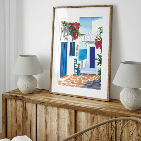 Charming Greek street scene with red blooms and ocean view

