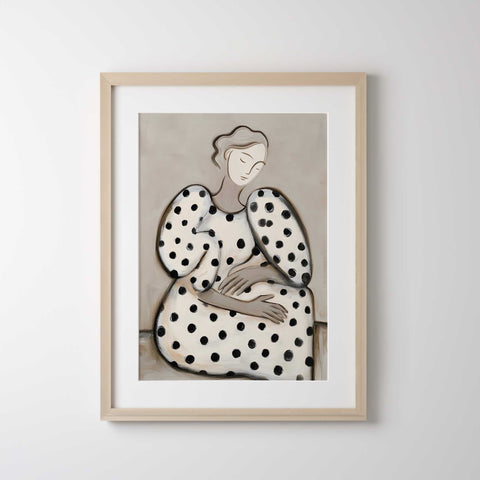 Chic wall decor featuring a woman in a polka dot pattern and neutral tones.