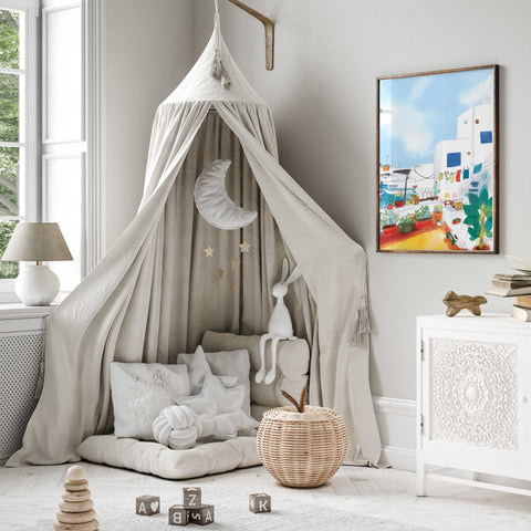 Colorful outdoor Greek courtyard with plants and seaside elements

