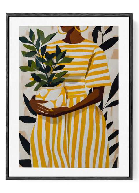 Contemporary portrait wall decor featuring large green tropical plant leaves.