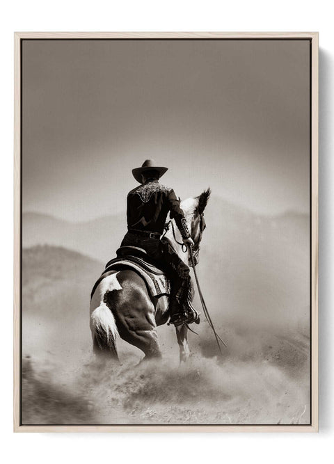 Cowboy Riding Horse in Dusty Trail Art Print