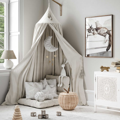 Cozy home decor with curled cat watercolor artwork

