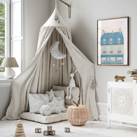 French rooftop scene with pink sky and soft floral details

