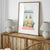 French watercolor print with pastel building and red patterned rug