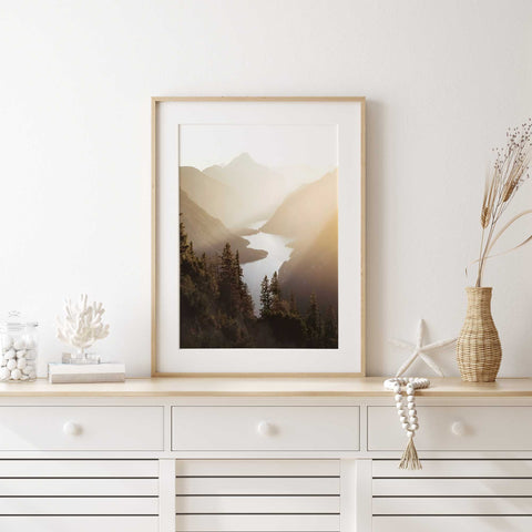 Minimalist nature wall art of a foggy mountain lake at sunrise.