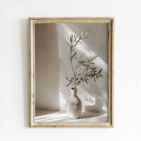 Olive branch in ceramic vase artwork