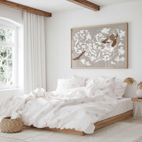 Peaceful feminine wall art featuring white petals and a serene portrait.