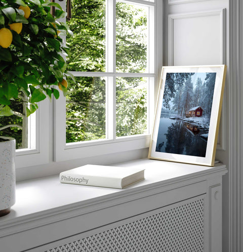 Pine forest winter wall art print with snow and lake cabin reflection