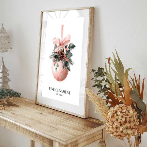 Pink ornament with pinecone holiday artwork