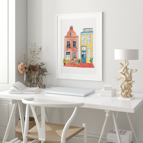 Red and yellow buildings wall decor

