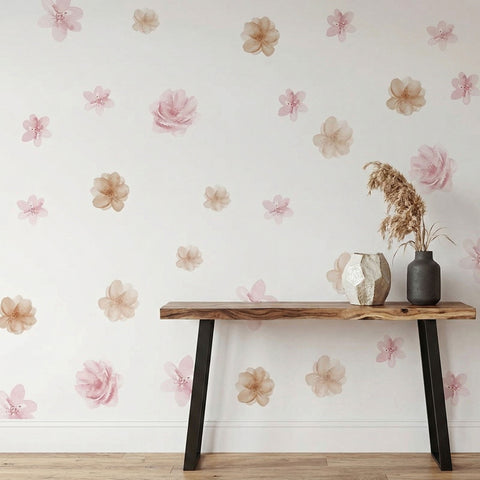 Wooden table with decorative vases against a floral wallpapered wall.
