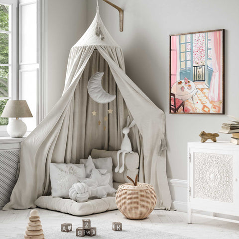 Romantic morning setup with sweets, tea, and blooming trees

