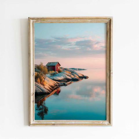 Rustic red cabin art print on rocky coastline for modern coastal living room decor
