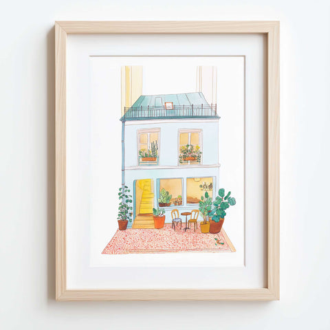 Small Parisian home scene with cafe chairs and soft rooftop detail


