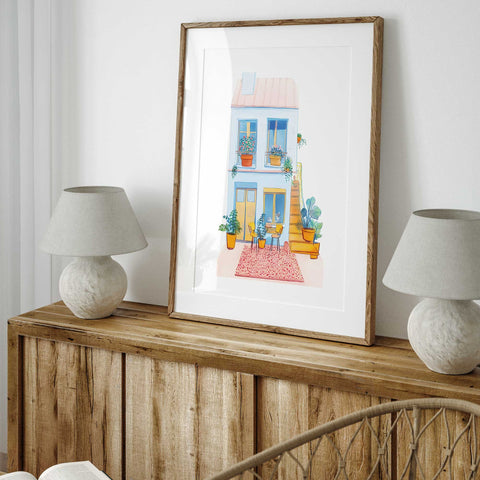 Vibrant watercolor of outdoor seating nook with rug and chairs

