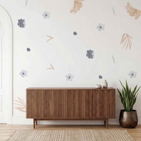 Wooden sideboard against a wall with decorative floral patterns