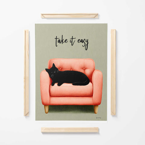 black cat artwork with armchair